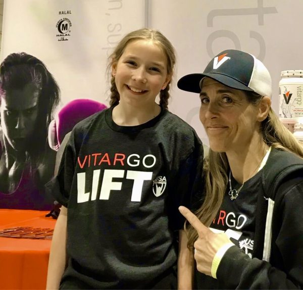 bernie and child posing in vitargo lift shirt