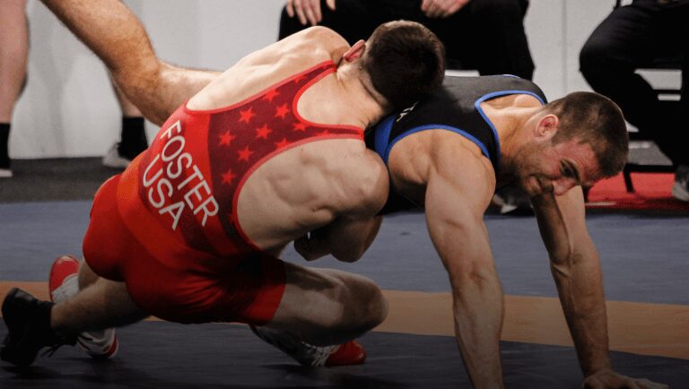 Wrestlers grappling during a competitive match