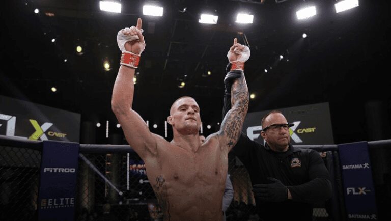 A man with his hands raised in the air.